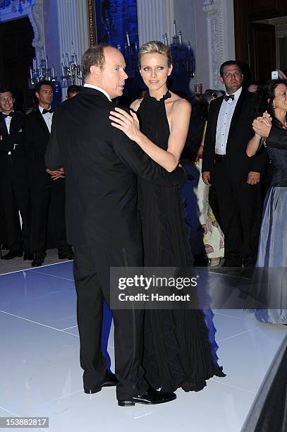 In this handout image provided by Ufficio Stampa Ballo del Giglio, Prince Albert of Monaco and princess Charlene of Monaco attend the 2012 Ballo del...