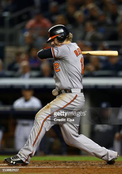 Mark Reynolds of the Baltimore Orioles is hit by a pitch during Game Three of the American League Division Series against the New York Yankees at...