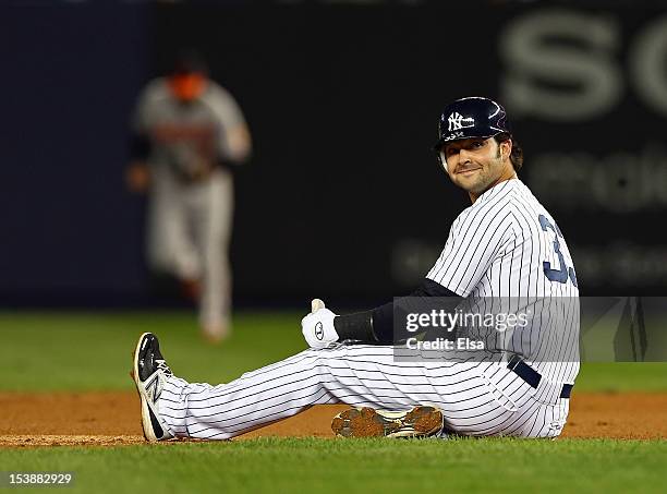 Nick Swisher of the New York Yankees looks on after an out against the Baltimore Orioles during Game Three of the American League Division Series at...