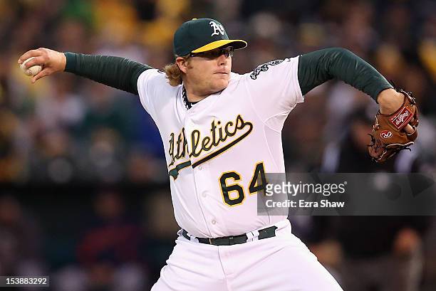 Griffin of the Oakland Athletics throws against the Detroit Tigers during Game Four of the American League Division Series in the first inning at...