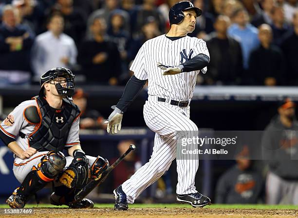 Raul Ibanez of the New York Yankees hits a solo home run in the bottom of the ninth inning to tie Game Three of the American League Division Series...