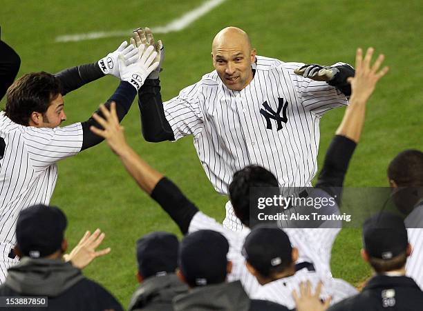 Raul Ibanez of the New York Yankees reacts after hitting a walk off home run in the bottom of the twelfth inning to defeat the Baltimore Orioles in...