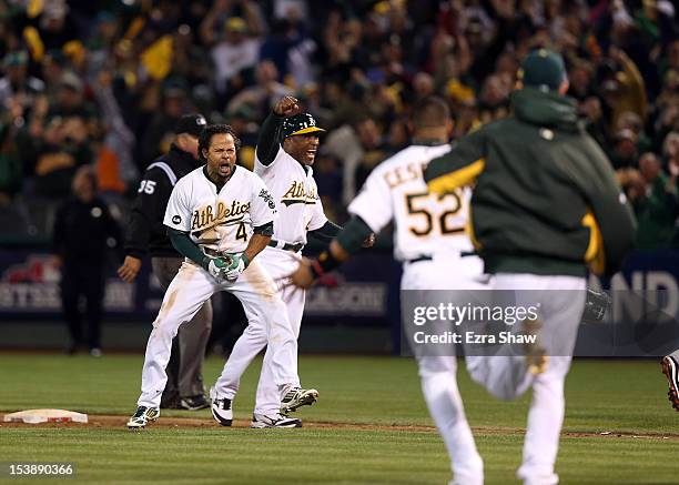 Coco Crisp of the Oakland Athletics celebrates after he hit a game-winning single to beat the Detroit Tigers in the ninth inning of Game Four of the...