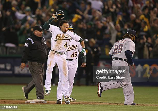 Coco Crisp of the Oakland Athletics celebrates after he hit a game-winning single to beat the Detroit Tigers in the ninth inning of Game Four of the...