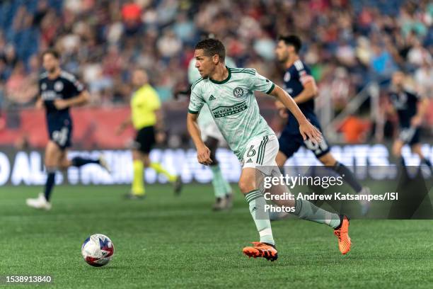 Osvaldo Alonso of Atlanta United brings the ball forward during a game between Atlanta United FC and New England Revolution at Gillette Stadium on...