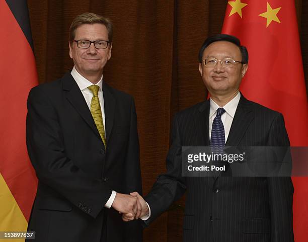 German Foreign Minister Guido Westerwelle shakes hands with Chinese Foreign Minister Yang Jiechi ahead of their meeting on October 11, 2012 in...