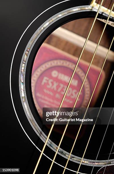 The strings and soundhole of a Yamaha FSX730SC acoustic guitar, during a studio shoot for Guitarist Magazine/Future via Getty Images, May 27, 2010.