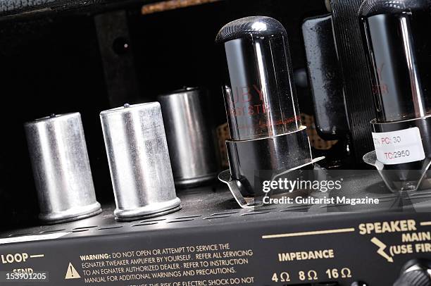 The electronics and vacuum tubes inside an Egnater Tweaker electric guitar amplifier head unit, during a studio shoot for Guitarist Magazine/Future...