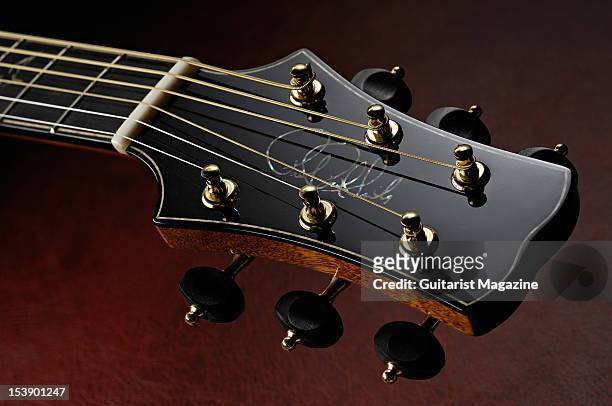 The headstock of a PRS Angelus Custom acoustic guitar during a studio shoot for Guitarist Magazine/Future via Getty Images, August 16, 2010.