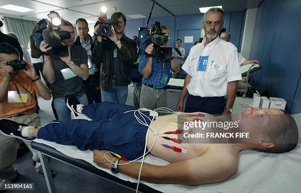 Leader of the US Postal Service team, US Lance Armstrong, undergoes a medical check-up before the 89th Tour de France in Luxembourg, 04 July 2002.The...