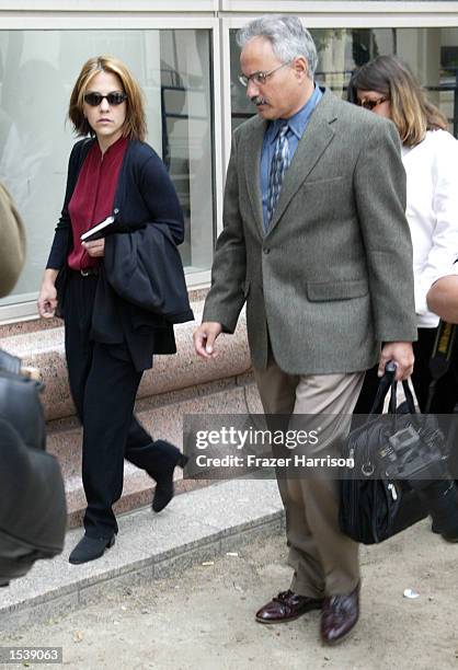 Actor Robert Blake's daughter, Delinah Blake , arrives for her father's hearing at the Van Nuys Superior Court with Scott Ross, a private...