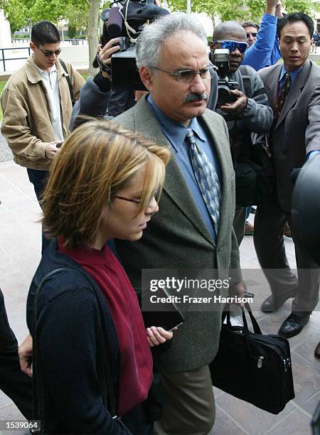 Actor Robert Blake's daughter, Delinah Blake , arrives for her father's hearing at the Van Nuys Superior Court with Scott Ross, a private...