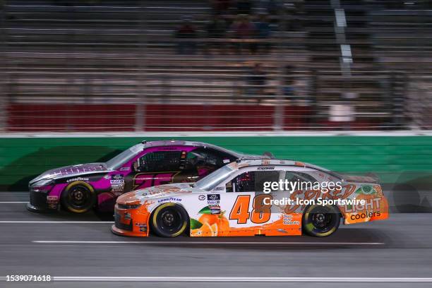 Parker Kligerman and Kaz Grala race side by side during the NASCAR Xfinity Series Alsco Uniforms 250 on July 8, 2023 at Atlanta Motor Speedway in...