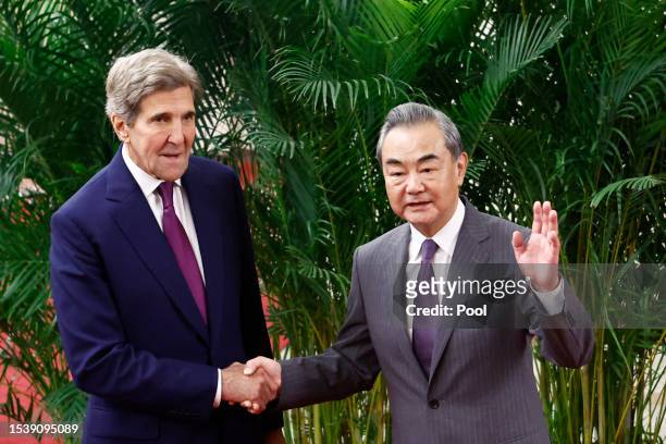 Climate envoy John Kerry is greeted by top Chinese diplomat Wang Yi before a meeting in the Great Hall of the People on July 18, 2023 in Beijing,...