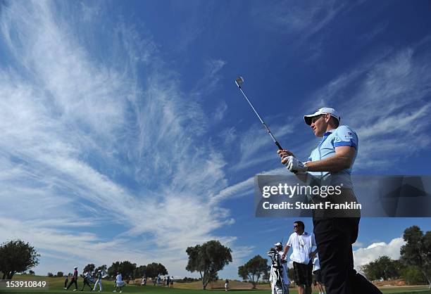 Stephen Gallacher of Scotland plays a shot during the first round of the Portugal Masters at the Victoria golf course at Villamoura on October 11,...