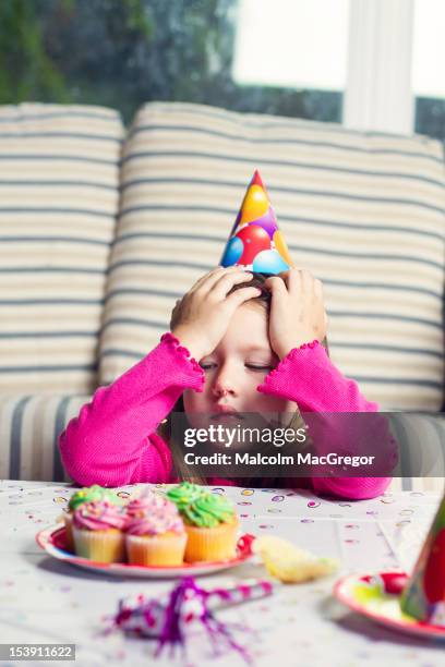 tired girl at birthday party - sad birthday stock pictures, royalty-free photos & images