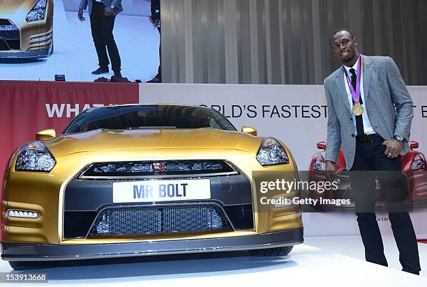 Olympic gold medalist Usain Bolt attends the Nissan GT-R promotional event at the Nissan Motor Co., headquarters on October 11, 2012 in Yokohama,...