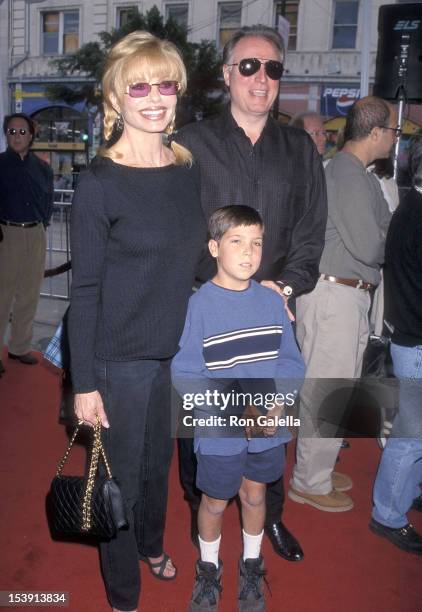 Actress Loni Anderson, boyfriend Geoff Brown and her son Quinton Reynolds attend "The Rugrats Movie" Hollywood Premiere on November 8, 1998 at the...