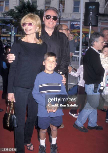 Actress Loni Anderson, boyfriend Geoff Brown and her son Quinton Reynolds attend "The Rugrats Movie" Hollywood Premiere on November 8, 1998 at the...