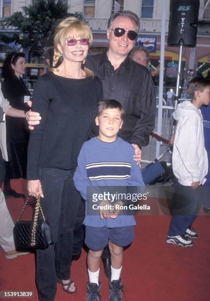 Actress Loni Anderson, boyfriend Geoff Brown and her son Quinton Reynolds attend "The Rugrats Movie" Hollywood Premiere on November 8, 1998 at the...