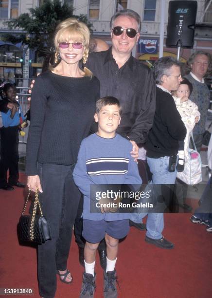 Actress Loni Anderson, boyfriend Geoff Brown and her son Quinton Reynolds attend "The Rugrats Movie" Hollywood Premiere on November 8, 1998 at the...
