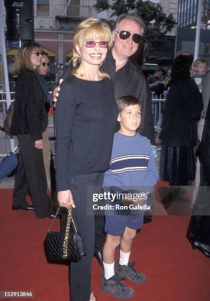 Actress Loni Anderson, boyfriend Geoff Brown and her son Quinton Reynolds attend "The Rugrats Movie" Hollywood Premiere on November 8, 1998 at the...