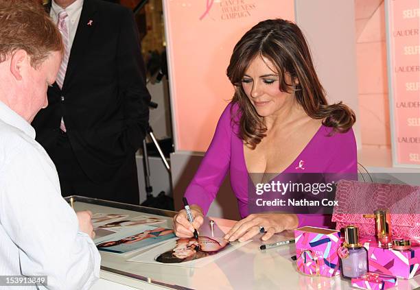 Elizabeth Hurley meets fans at a personal appearance in support of the Estee Lauder Companies Breast Cancer Awareness campaign at Selfridges Trafford...