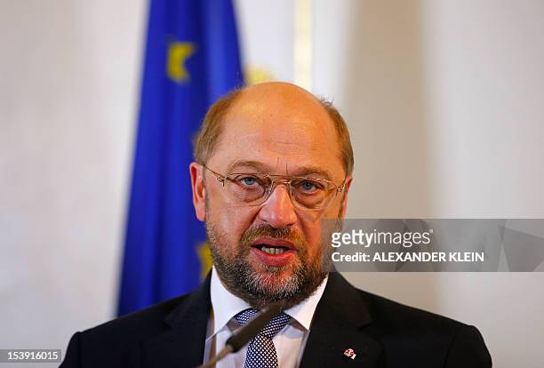 European Parliament President Martin Schulz looks on as he answers questions during a press conference with Austrian Chancellor in Vienna on October...