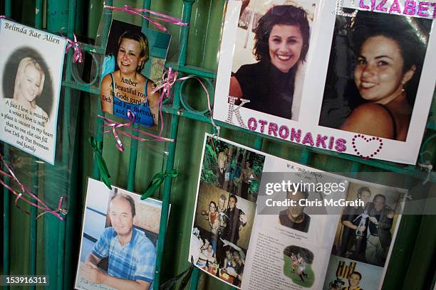 Photographic tributes hang on a fence at the site of the Sari Club in Jalan Legian, Bali, on October 11, 2012. Many relatives and foreign tourists...