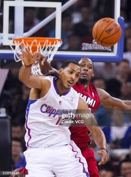 Mickell Gladness of the Miami Heat defends against Ryan Hollins of the Los Angeles Clippers during a pre-season game as a part of the 2012 NBA China...