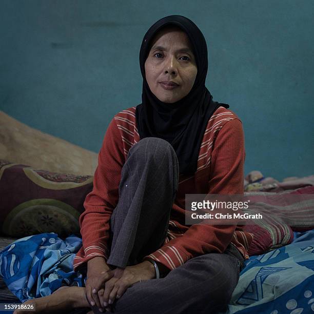Bali bombing widow Endang Isnani, 41 poses for a portrait in her home in Bali on October 11, 2012 in Kuta, Indonesia. Endang lost her husband Aris...