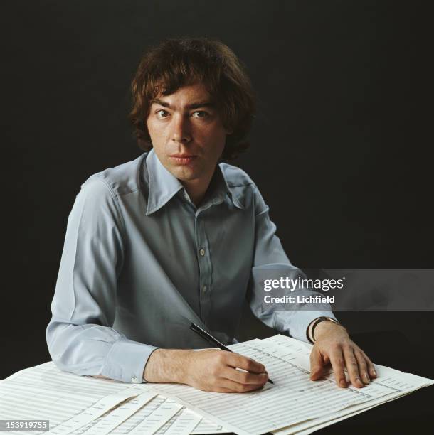 English composer Andrew Lloyd Webber at work on a piece of music, 1982.