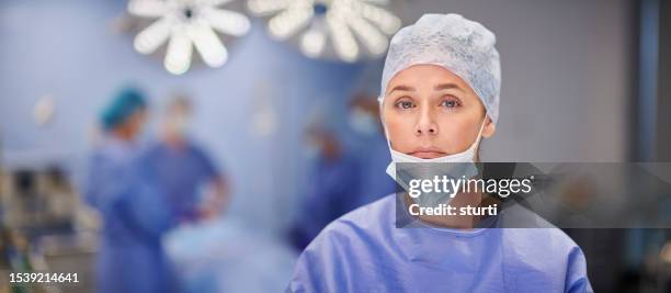 operating theatre portrait - blue surgical mask stock pictures, royalty-free photos & images