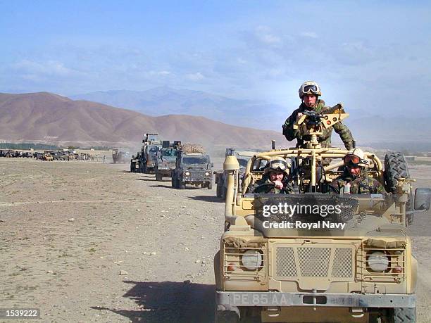 Convoy of Royal Marine Commandos makes its way through the Afghan countryside April 30, 2002 on its way to the Forward Operating Base as the troops...