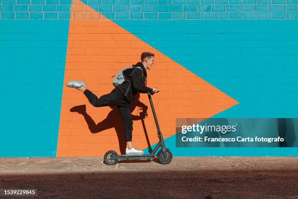 stand out from the crowd - monopattino foto e immagini stock