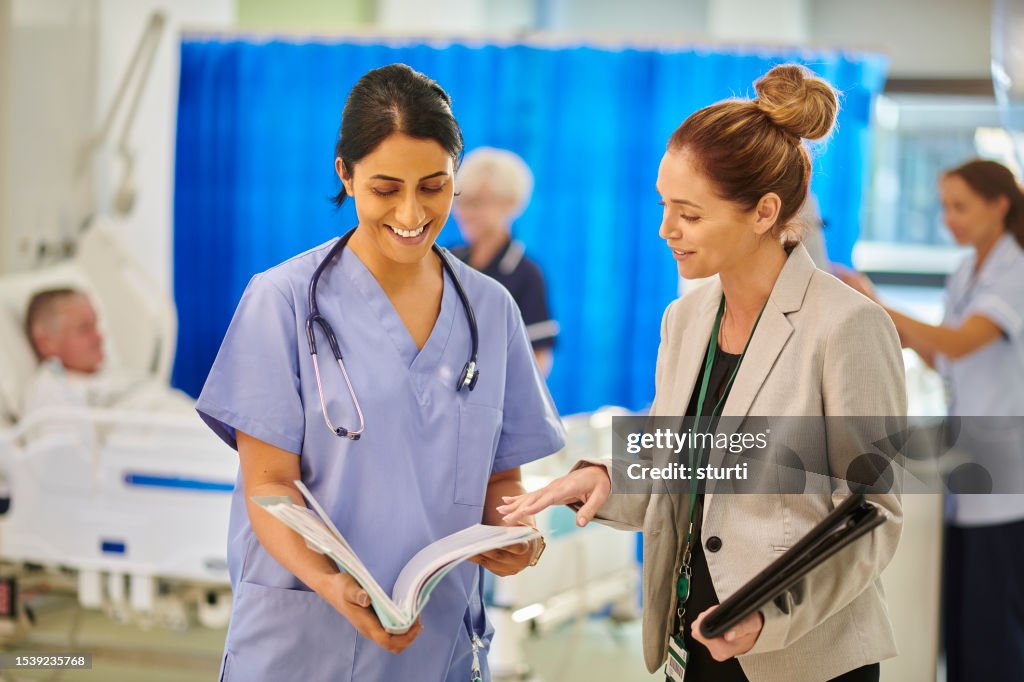Medical dales representative with female doctor