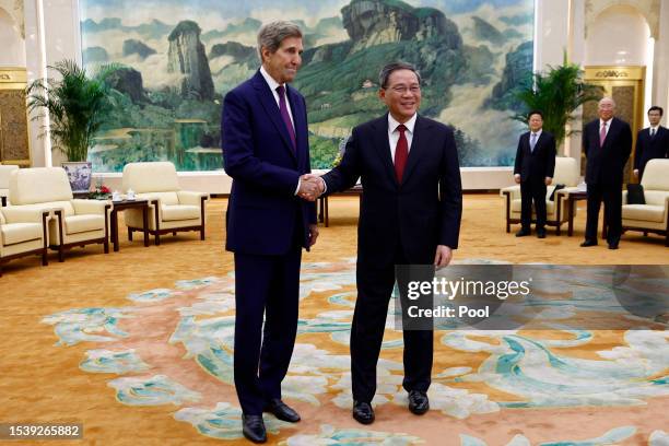 Climate envoy John Kerry is greeted by Chinese Premier Li Qiang before a meeting in the Great Hall of the People on July 18, 2023 in Beijing, China....