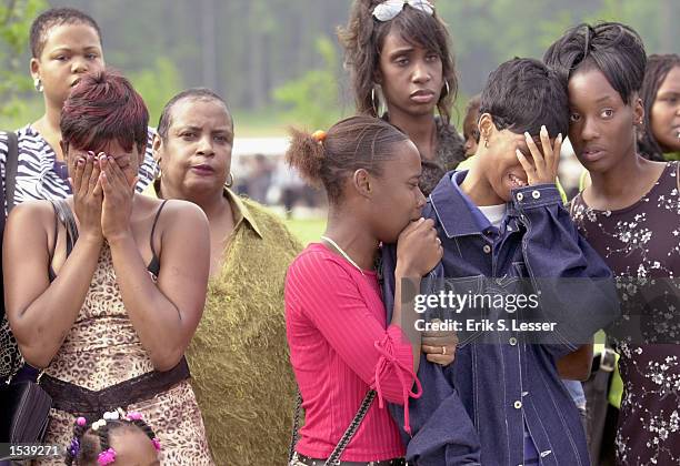 Fans react to arrival of the body of TLC singer Lisa "Left Eye" Lopes for her public funeral at the New Birth Missionary Baptist Church May 2, 2002...