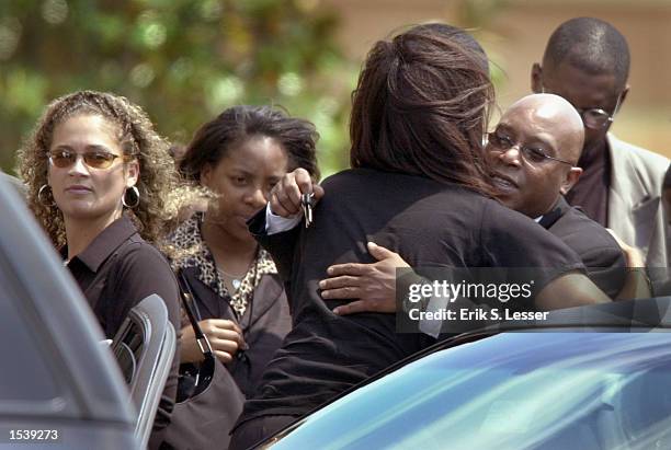 Family and friends arrive for the funeral of singer Lisa "Left Eye" Lopes at the New Birth Missionary Baptist Church May 2, 2002 in Lithonia, GA....