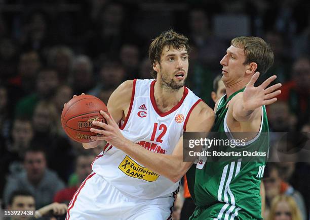 Luksa Andric, #12 of Cedevita Zagreb competes with Jeff Foote, #31 of Zalgiris Kaunas during the 2012-2013 Turkish Airlines Euroleague Regular Season...