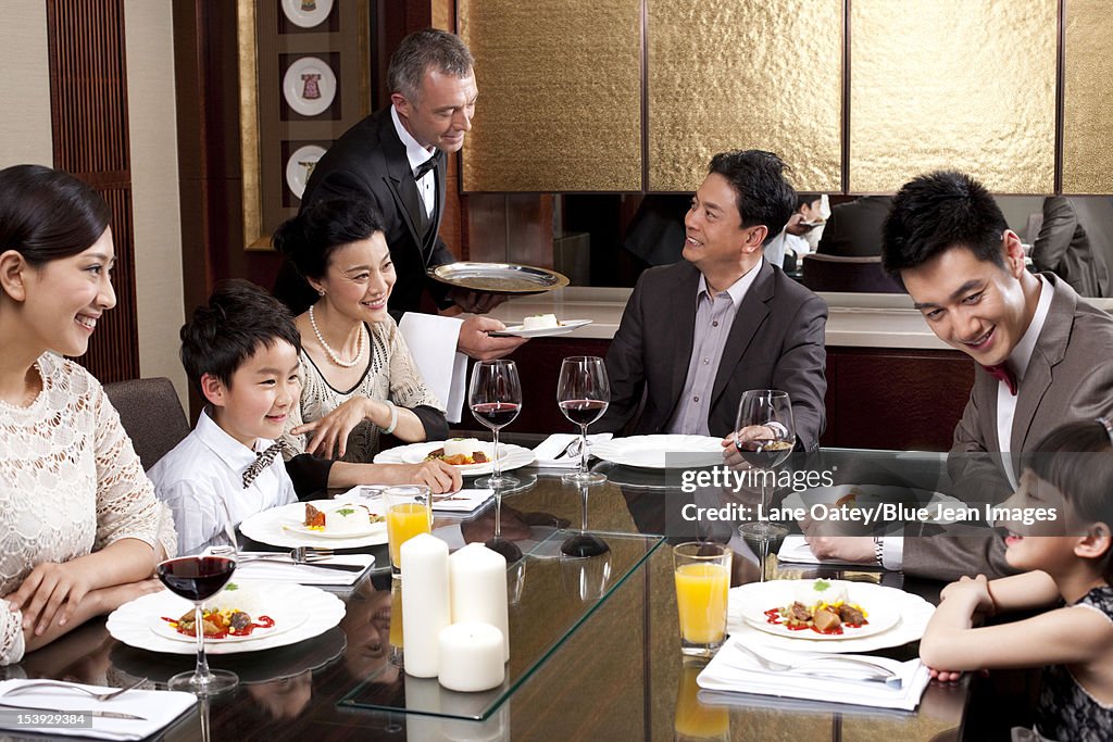 Family having dinner in a luxurious dinning room