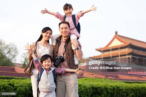 happy family travelling at tiananmen square in beijing, china - tiananmen square ストックフォトと画像