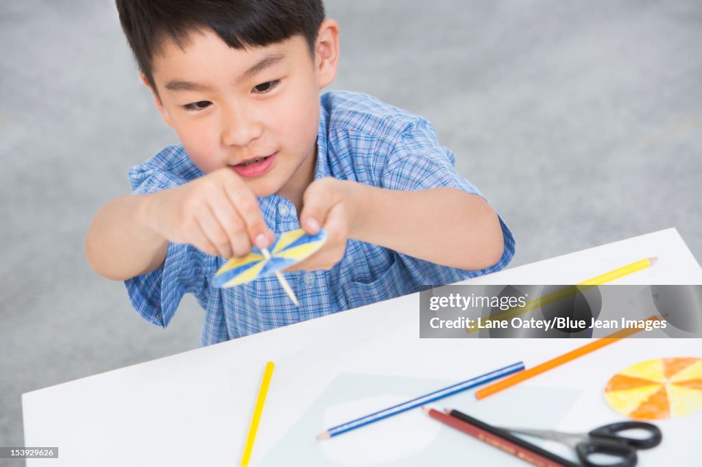 Boy Using Paper Boy Making A Paper Toy High-Res Stock Photo - Getty Images