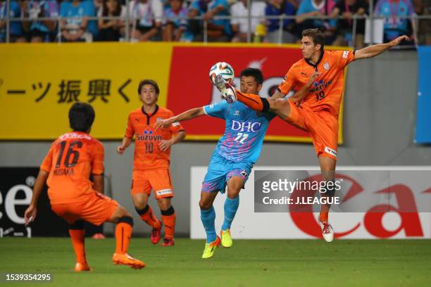 Kei Ikeda of Sagan Tosu and Dejan Jakovic of Shimizu S-Pulse compete for the ball during the J.League J1 match between Sagan Tosu and Shimizu S-Pulse...