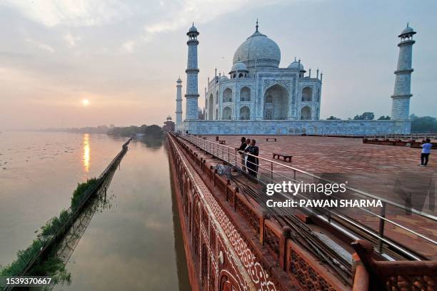 This photograph taken on July 18, 2023 shows flooded banks of river Yamuna along the Taj Mahal in Agra. Flooding and landslides are common and cause...