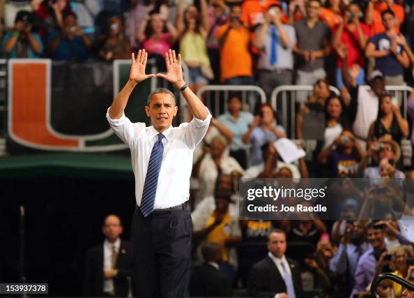 Obama Rasing His Hand U.S. President Barack Obama puts his hands in the shape of a U, which ...