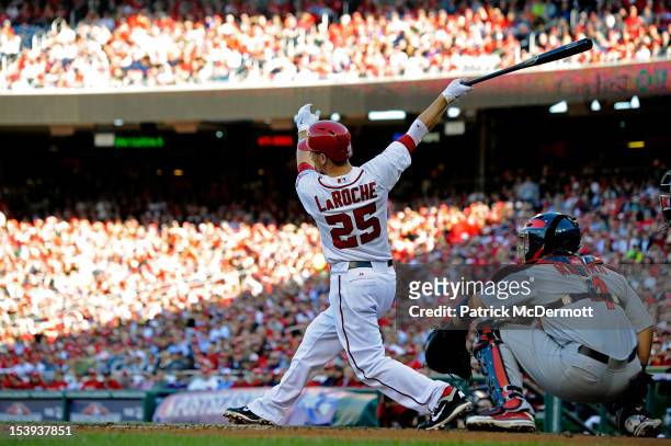 Adam LaRoche of the Washington Nationals hits a solo home run in the bottom of the second inning against the St. Louis Cardinals during Game Four of...