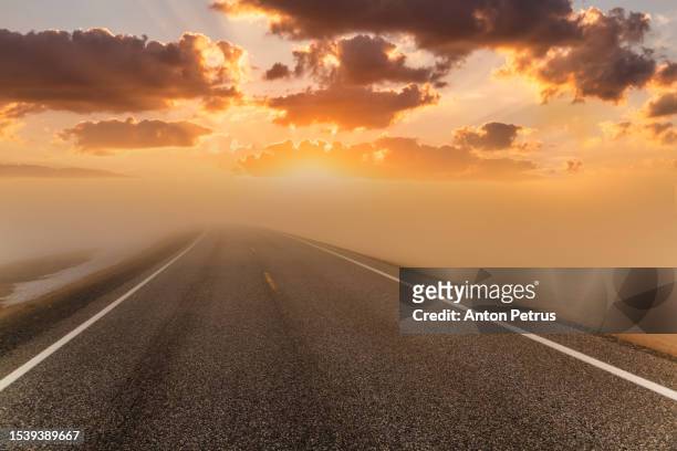 road at foggy dawn in the mountains - anton petrus panorama of beautiful sunrise bildbanksfoton och bilder
