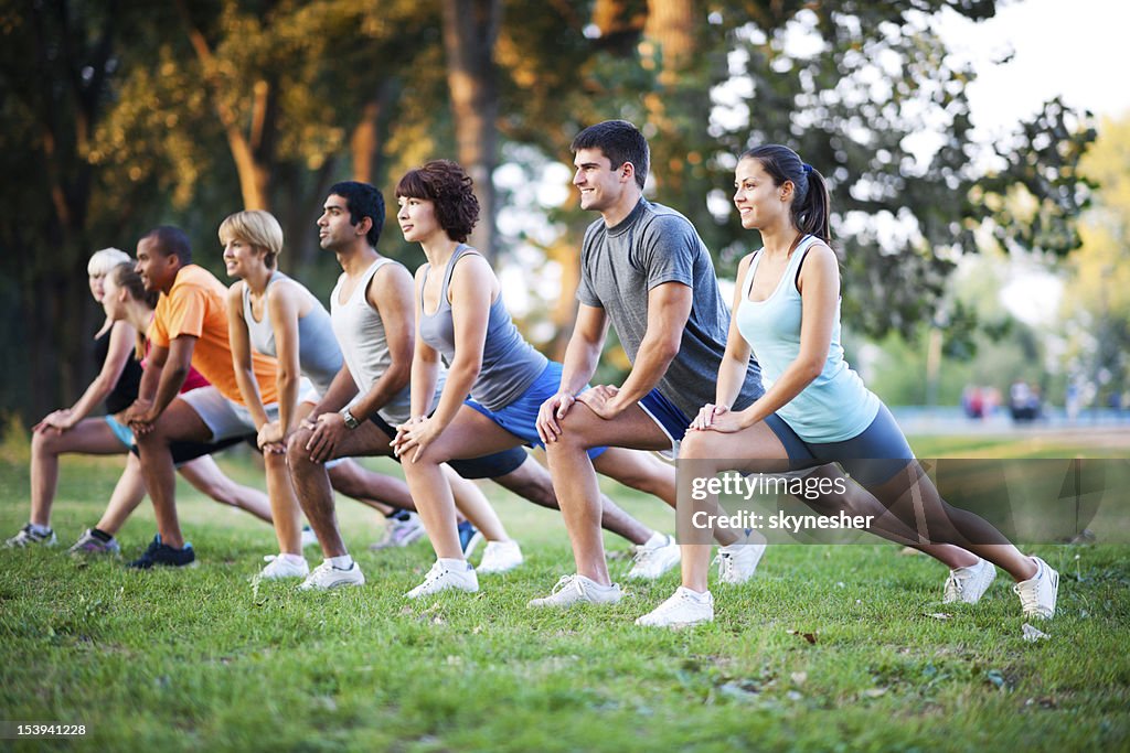 Group of people doing stretching exercises.