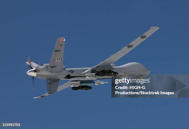 an mq-9 reaper flies a training mission out of holloman air force base, new mexico. - weapon stock pictures, royalty-free photos & images